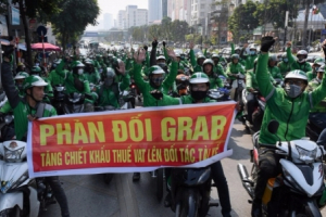 Grab nói 'ngồi chung thuyền với tài xế' nhưng chưa thể thay đổi tỷ lệ khấu trừ